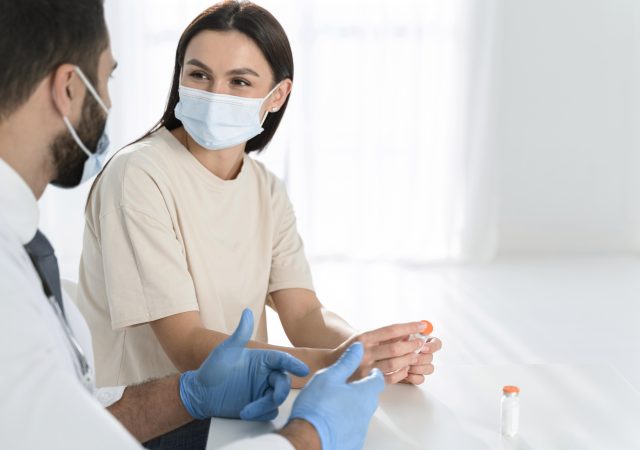Doctor Discussing Pilonidal Cyst Care and Treatment with Patient