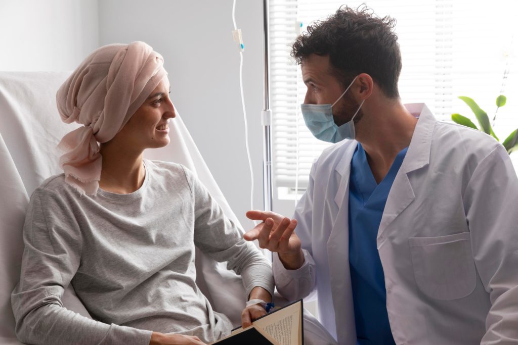 Healthcare assistant caring for a leukemia patient