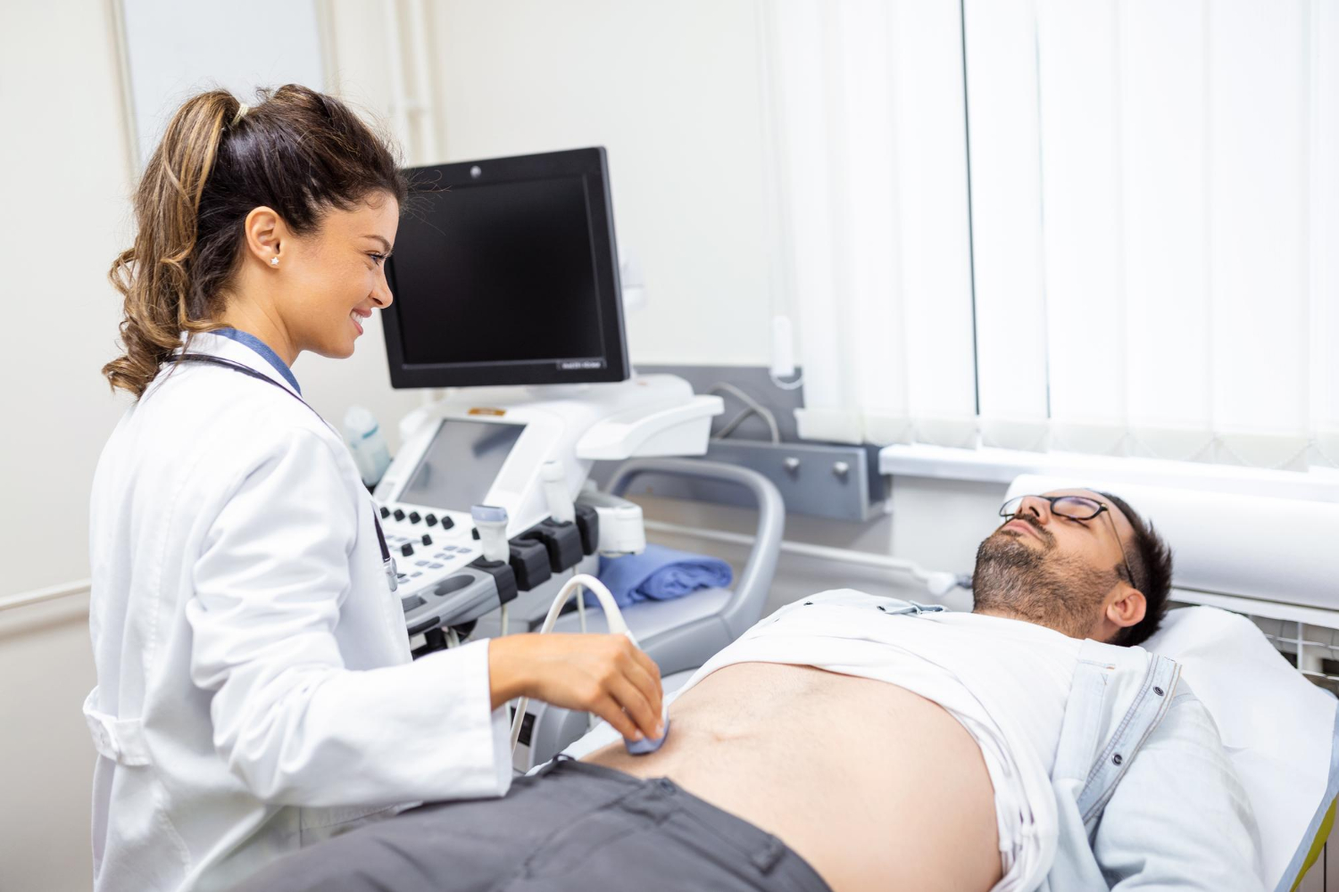 Doctor performing an abdominal diagnostic examination