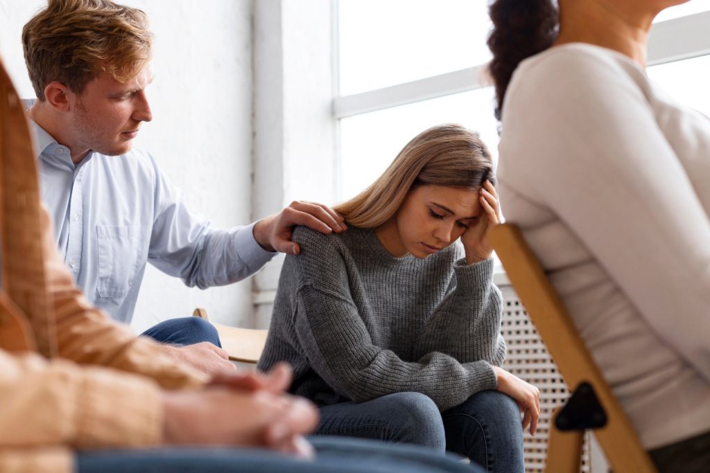 Woman participating in a mental health group therapy session