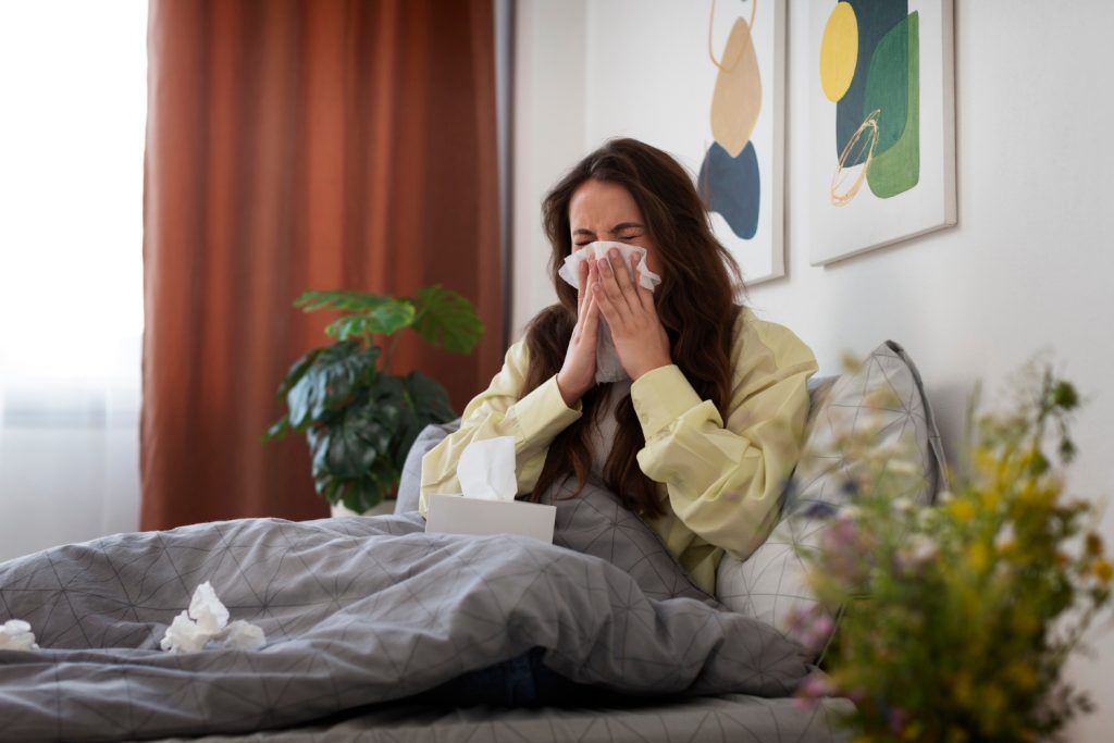 Woman experiencing seasonal allergy symptoms in Quebec